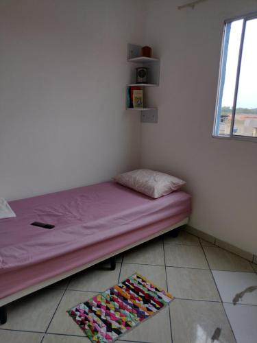 Ένα ή περισσότερα κρεβάτια σε δωμάτιο στο Aquarela dormitórios
