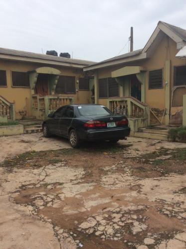 a black car parked in front of a house at Charimide properties in Apena