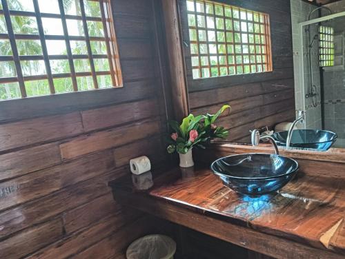 a bathroom with a wooden counter with a sink at Kohjum Freedom Resort in Ko Jum