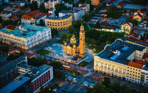 an overhead view of a city with a clock tower at Apartman Filipović in Banja Luka