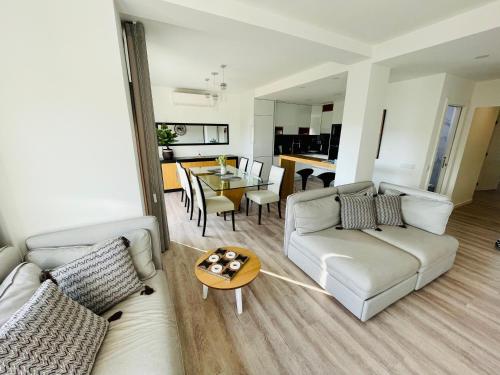 a living room with a couch and a table at Top View Apt at Historical Center in Coimbra