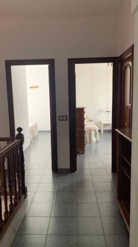 a room with two doors leading to a bedroom at La Pontezuela in Chipiona