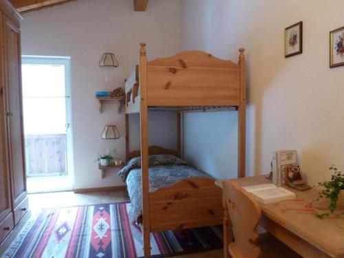 Ένα ή περισσότερα κρεβάτια σε δωμάτιο στο Casa Canazei