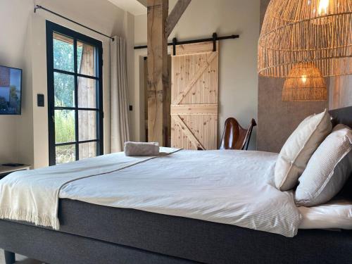 Postel nebo postele na pokoji v ubytování d'Oude Smidse