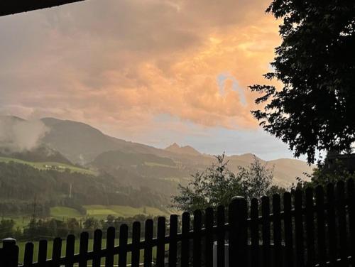 a fence with a view of a valley with mountains at Ferienwohnung Dani II in Gröbming