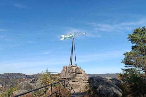 a wind turbine on top of a rock at Ferienwohnung im Fachwerkhaus in Sebnitz