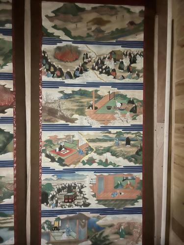 a tapestry hanging on a wall in a room at 長徳寺宿坊　Temple Hotel in Shingu