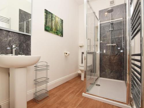 a bathroom with a shower and a sink at 3 Bed in Wolsingham 36671 in Wolsingham