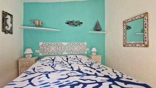 Ένα ή περισσότερα κρεβάτια σε δωμάτιο στο Dòmo a Palàttu casa vista mare a Porto Rotondo