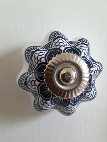 a blue and white plate with a flower on it at Villa Benvenuto in Dieren