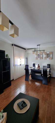 a large living room with a table and chairs at Casa Las 7 Maravillas in Fuentidueña de Tajo