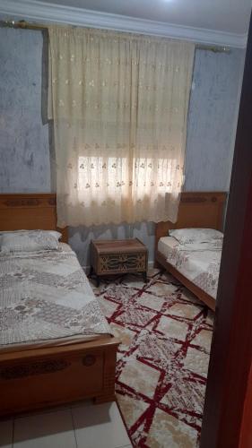 Ліжко або ліжка в номері Appartement Stade Tanger