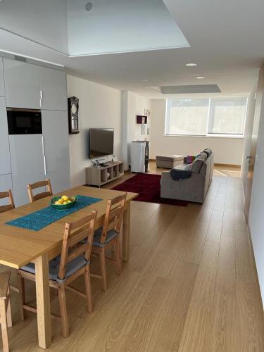 a living room with a table and a couch at Moradia com jaccuzzi e sky view in Bombarral