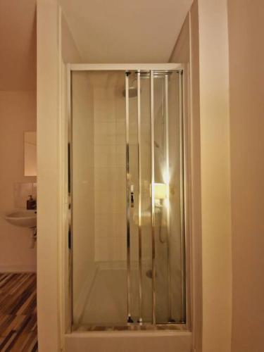 a shower with a glass door in a bathroom at Private room 202 - Eindhoven - By T&S. in Eindhoven