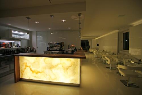 a lobby with a large marble counter in a restaurant at Hotel IN in Međugorje