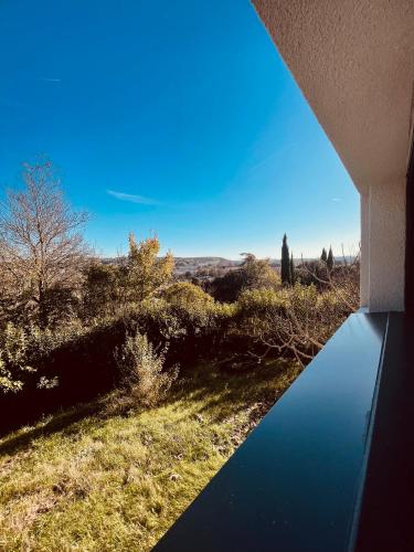 a view from a balcony of a house with a blue sky at T1 bis rénové au centre d’Auch in Auch