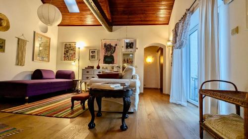 a living room with a couch and a table at Casa do Paço Aveiro HolidayHome in Aveiro