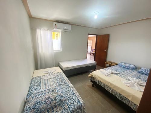 A bed or beds in a room at Casa Morada da Praia 1