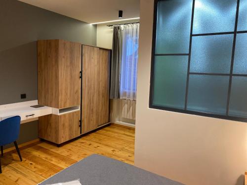an empty room with a desk and a window at Arevaham Boutique Hotel in Stepʼanavan