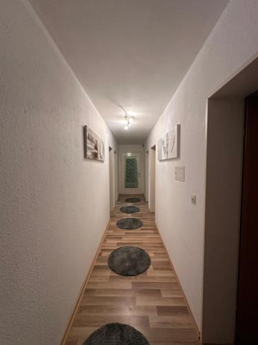 a hallway with several rugs on the floor of a room at Stilvolle 2-Zimmer-Anliegerwohnung in Tuttlingen in Tuttlingen
