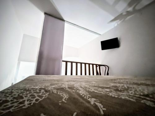 Ένα ή περισσότερα κρεβάτια σε δωμάτιο στο DOMUS ESSENTIA