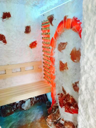 a room with a fireplace with snow on the walls at Meggyes Hotel in Szerencs
