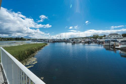 a view of a river with boats in a marina at Weathervane Inn in Montague