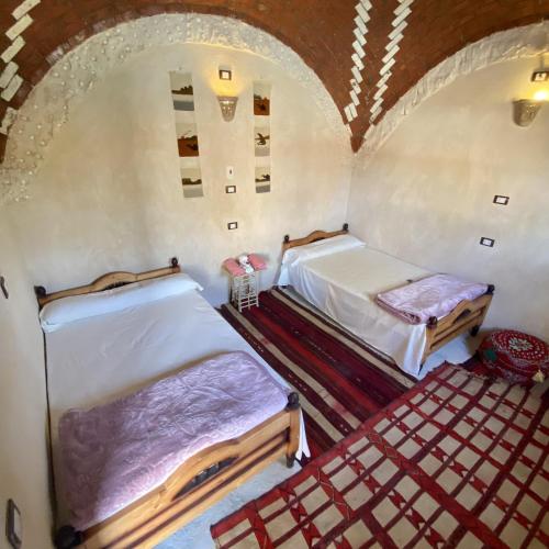 Katil atau katil-katil dalam bilik di Siwa Palace Lodge