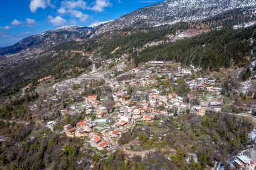 an aerial view of a town on a mountain at Helmos Mountain Retreat in Zarouhla