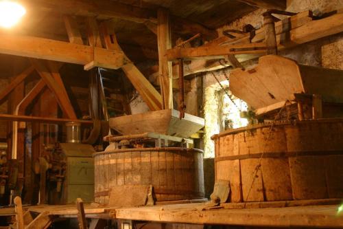 a room with two large wooden barrels in a building at B&B Il Mulino in Sanfront