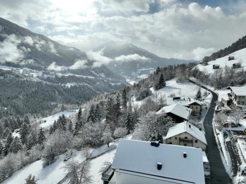 a view of a snow covered valley with a mountain at Apart Alpenzeit in Arzl im Pitztal