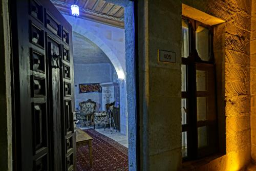 an open door to a room with a dining room at MDC Cave Hotel Cappadocia in Urgup