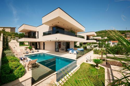 an aerial view of a house with a swimming pool at Villas Lucy - 1 Lemon -outdoor pool , 2 Cherry-indoor pool and 3 Plum-outdoor pool in Marina