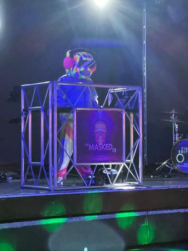 a person sitting on a stage with a microphone at Perranporth Holiday Park in Perranporth