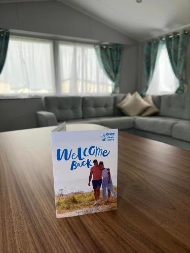 a magazine sitting on a table in a living room at Perranporth Holiday Park in Perranporth