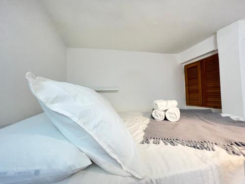 a bedroom with a bed with two pillows on it at Acogedor Estudio Cervantes in Madrid