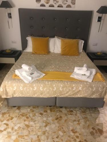 a bedroom with a bed with two towels on it at Ai Senatori in Rome