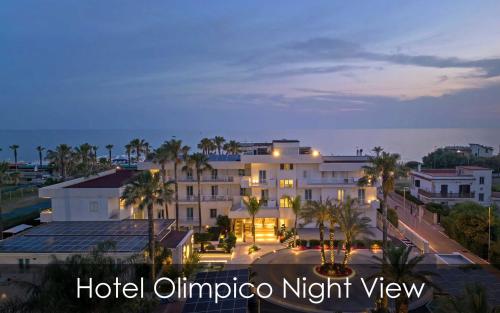 a hotel omnicuto night view of a building at Hotel Olimpico in Pontecagnano