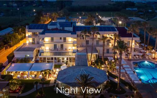 an aerial view of a night view of a building at Hotel Olimpico in Pontecagnano
