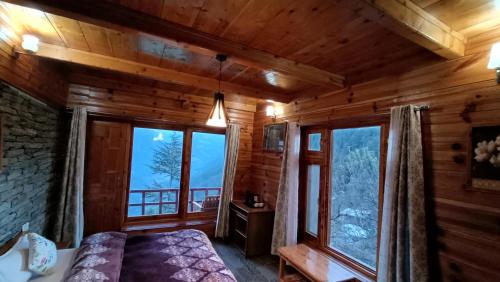 Ishan Log Huts-A boutique home stayにあるベッド