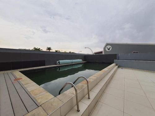 a swimming pool on the roof of a house at Mary-B Contemporary Apartment in Windhoek