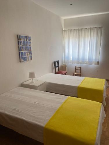 En eller flere senge i et værelse på Apartamento Mira Rocha