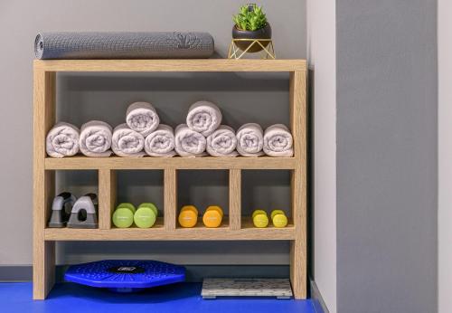 a wooden shelf with plates and bowls on it at Villas Lucy - 1 Lemon -outdoor pool , 2 Cherry-indoor pool and 3 Plum-outdoor pool in Marina
