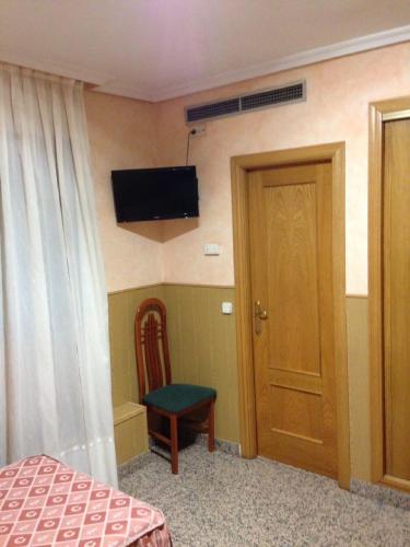 Hostal Juan XXIIIにあるテレビまたはエンターテインメントセンター