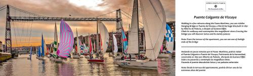 a book with a bunch of sail boats in the water at Atico Lujo Costa Vasca Bilbaoterraza mar jacuzi in Santurce