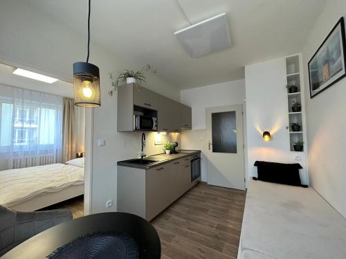 Postel nebo postele na pokoji v ubytování Morava apartmán Uherské Hradiště Šafaříkova 855