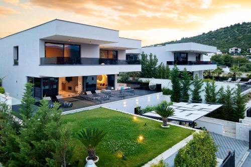 an aerial view of a house with a yard at Villas Lucy - 1 Lemon -outdoor pool , 2 Cherry-indoor pool and 3 Plum-outdoor pool in Marina