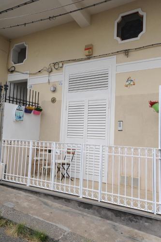 a white garage door on a house at MAMIS in Catania