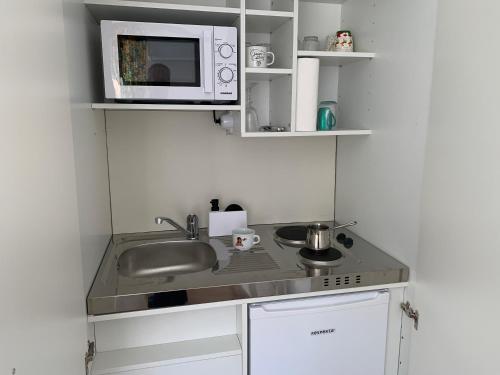 Kuchyň nebo kuchyňský kout v ubytování CappucciNo25 Osijek
