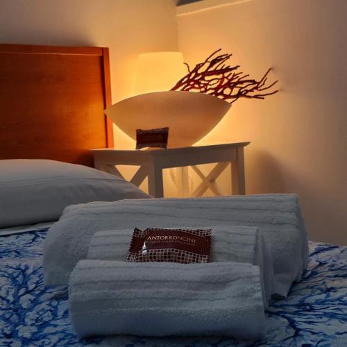 Postel nebo postele na pokoji v ubytování B&B L' Oasi